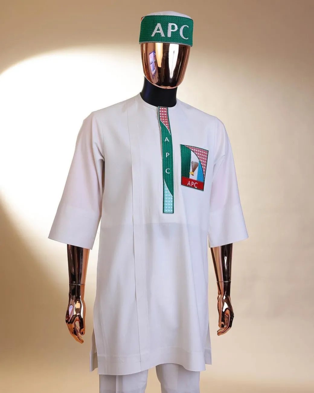 A white, APC ( All Progressive Congress) pattern embroidery, 3/4 sleeve African senator kaftan native.