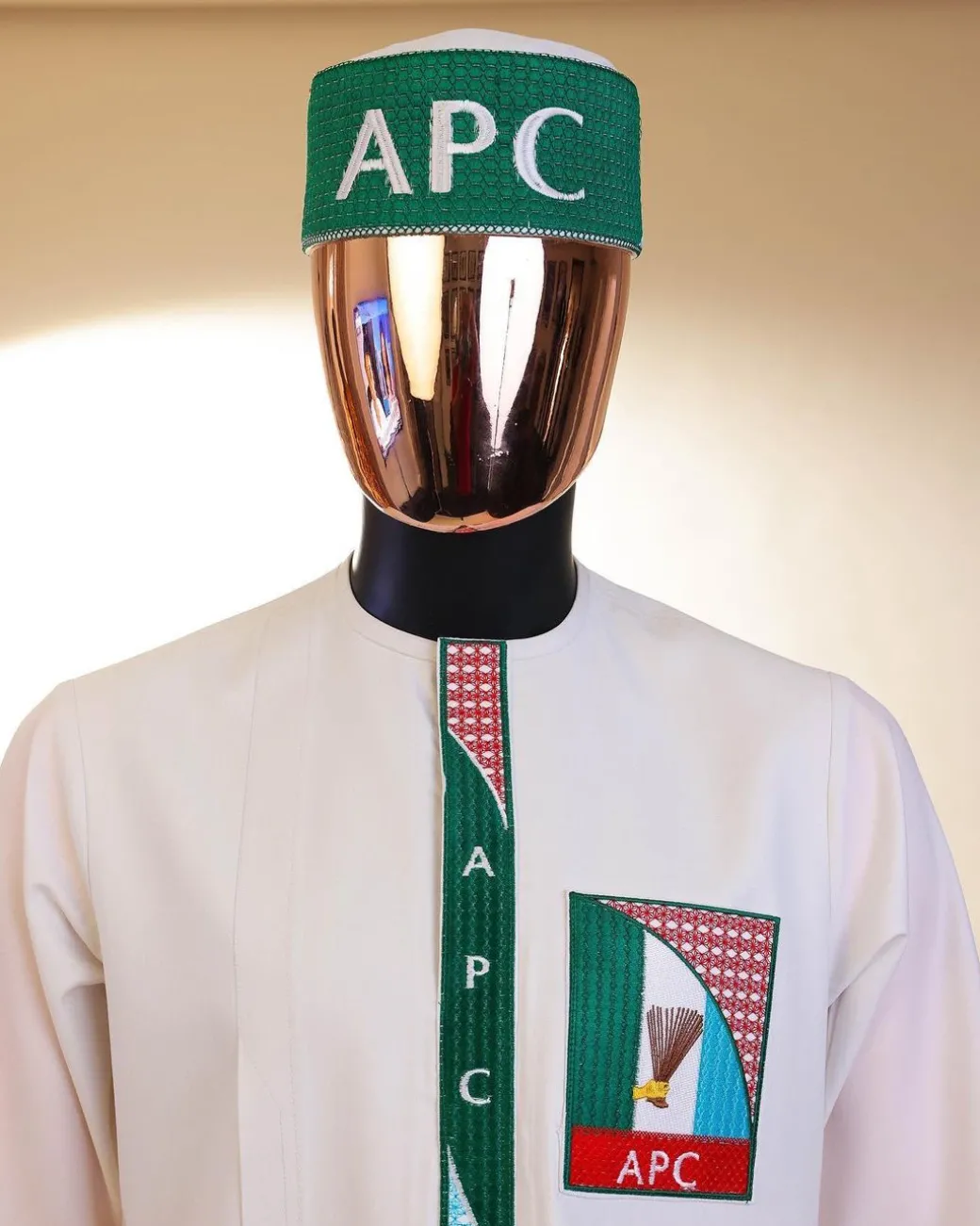 A white, APC ( All Progressive Congress) pattern embroidery, 3/4 sleeve African senator kaftan native.