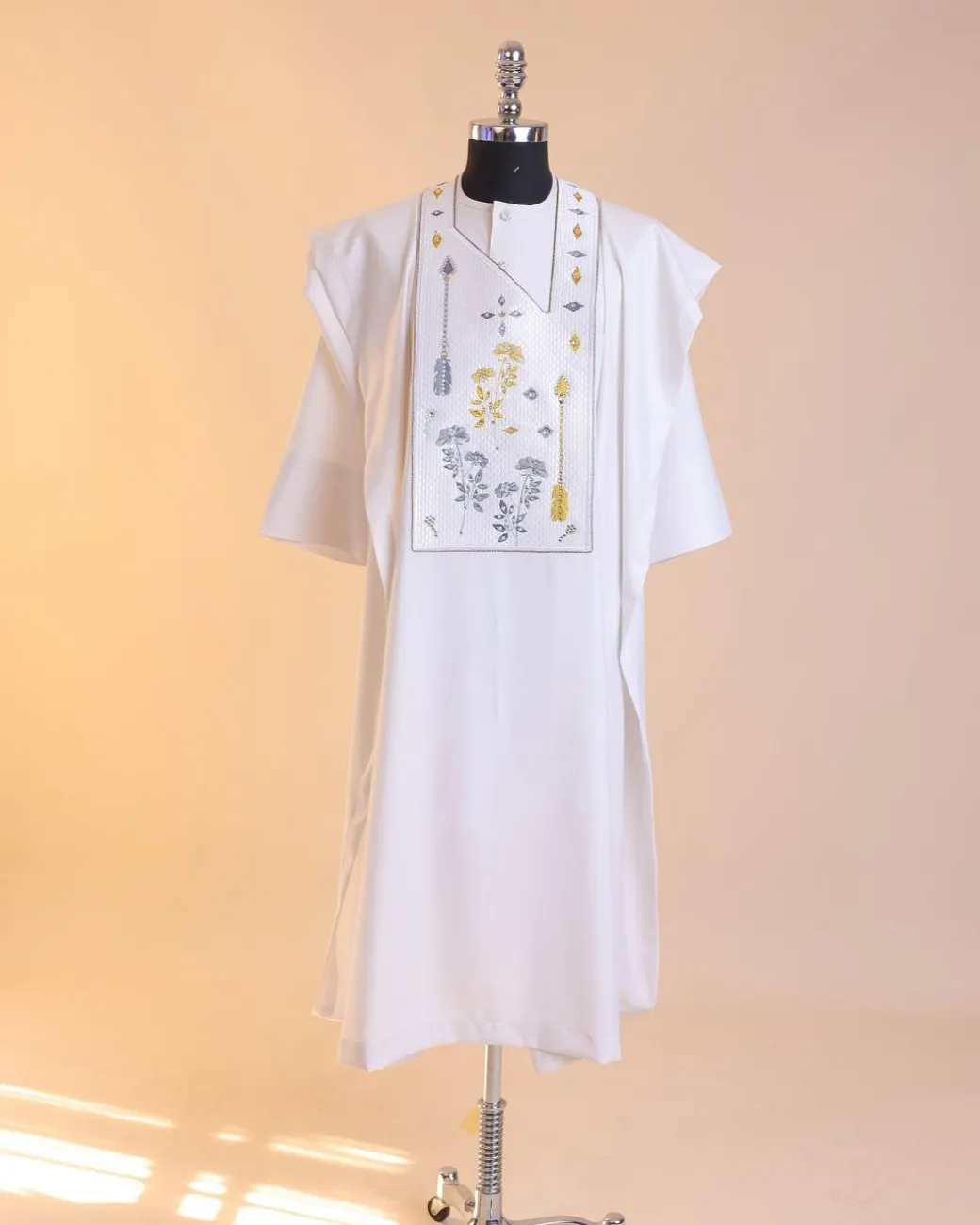 A White, arrow and floral metallic wire embroidery design with ss30 and ss20 gold and grey Swarovski stone details agbada