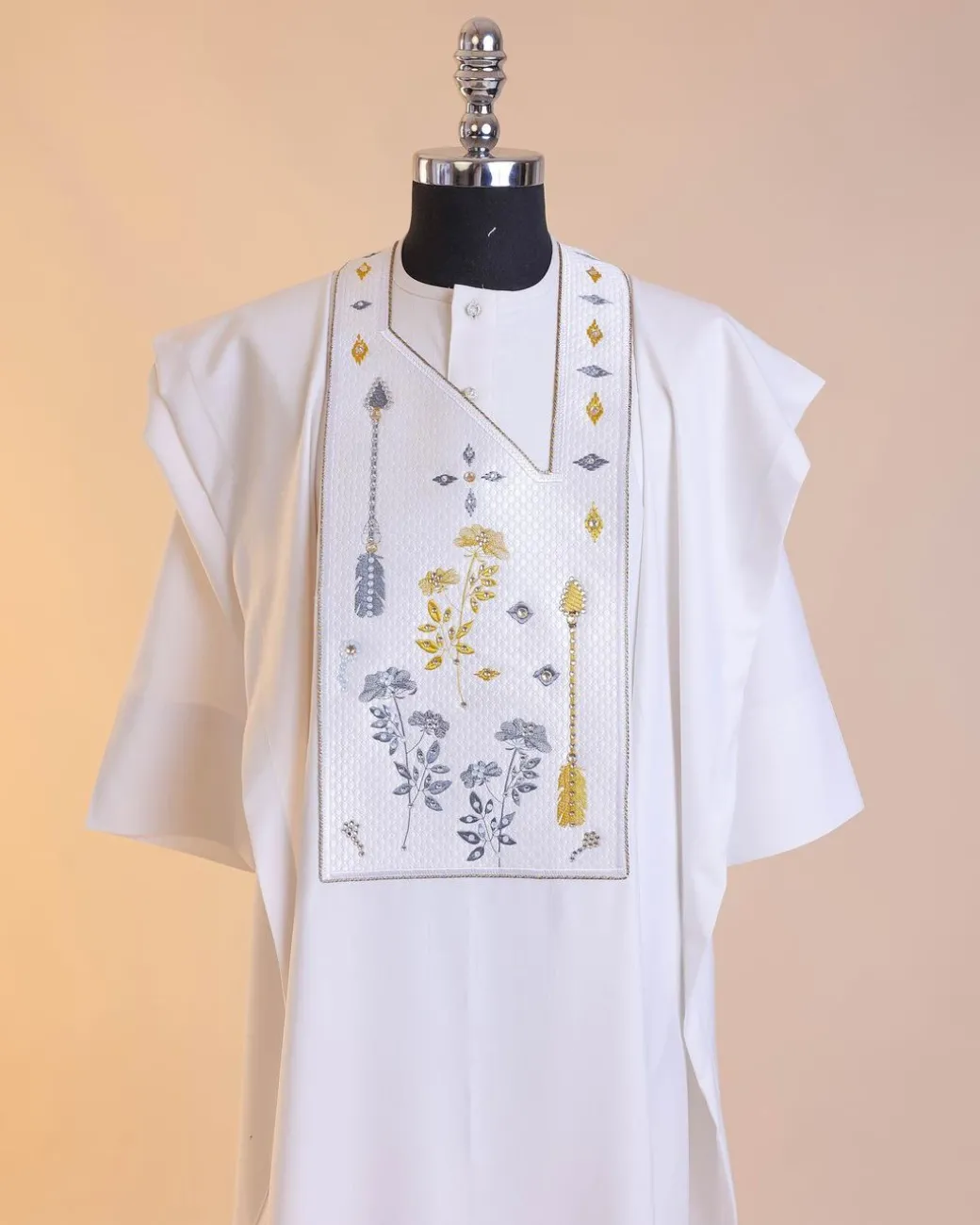 A White, arrow and floral metallic wire embroidery design with ss30 and ss20 gold and grey Swarovski stone details agbada