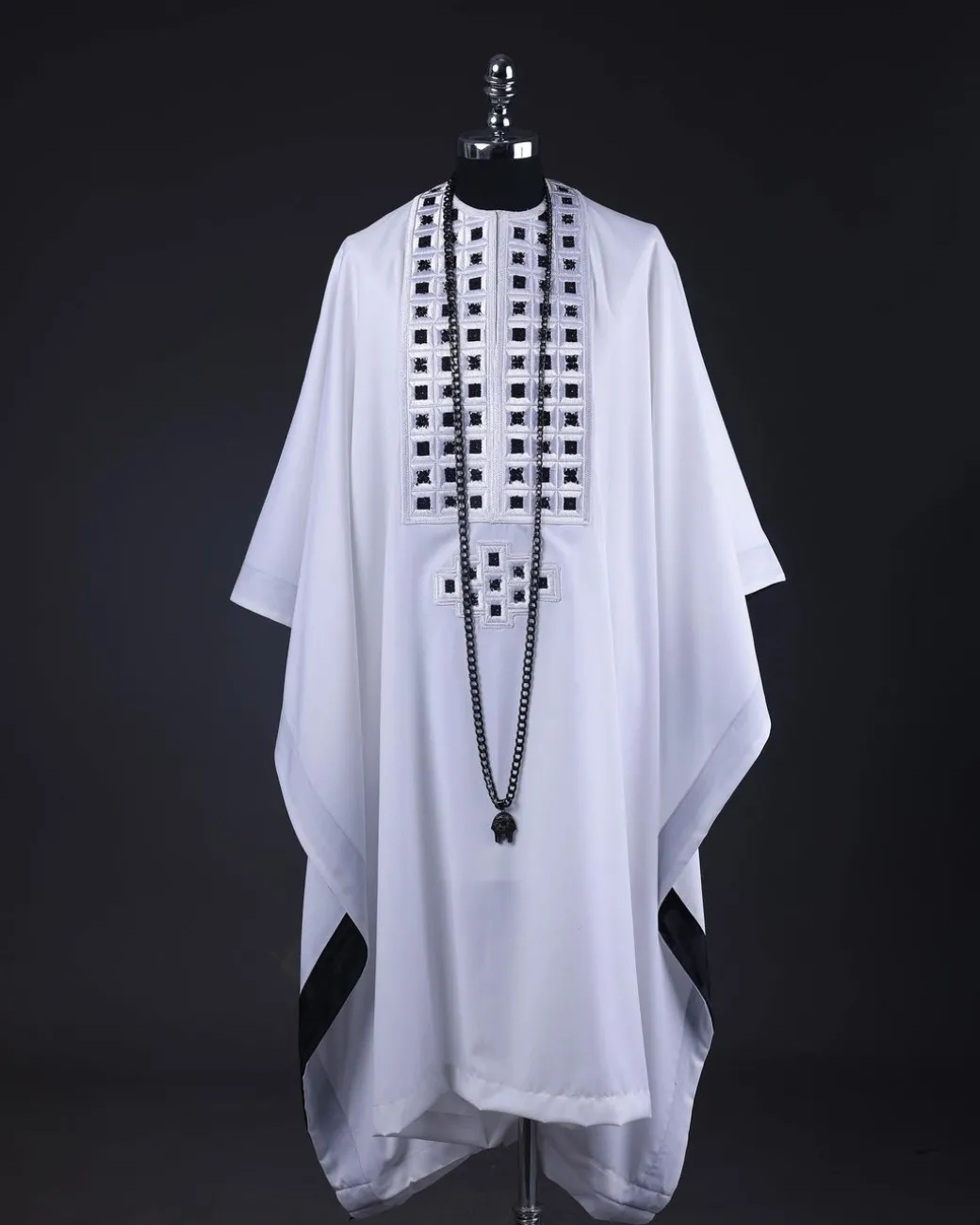 A White, Connected Square Embroidery Design With Matching Black And Silver Swarovski Stone Details Agbada