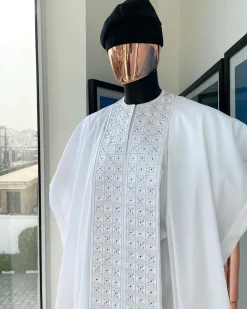 A white, connected square embroidery design with matching silver and black Swarovski stone details agbada