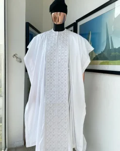 A white, connected square embroidery design with matching silver and black Swarovski stone details agbada