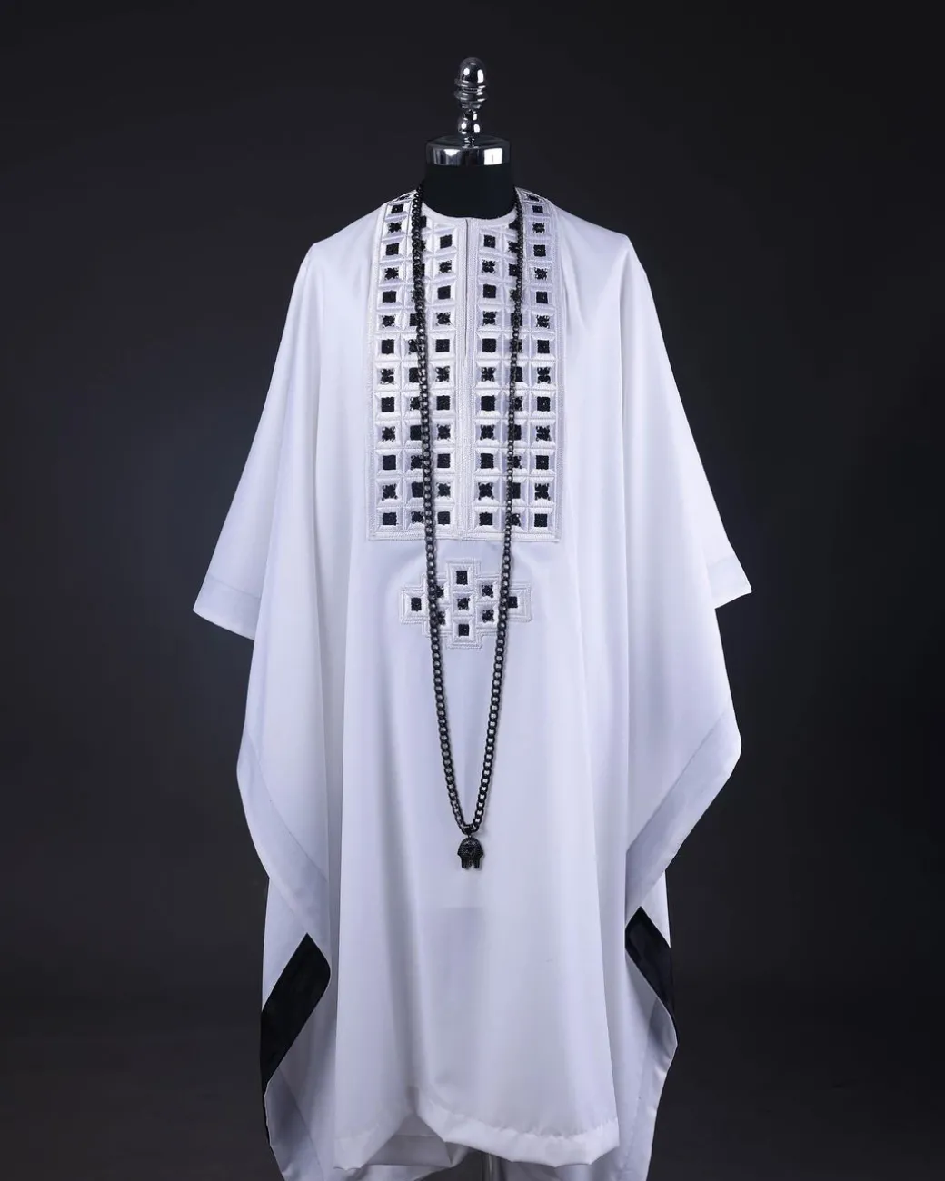 A White, Connected Square Embroidery Design With Matching Black And Silver Swarovski Stone Details Agbada