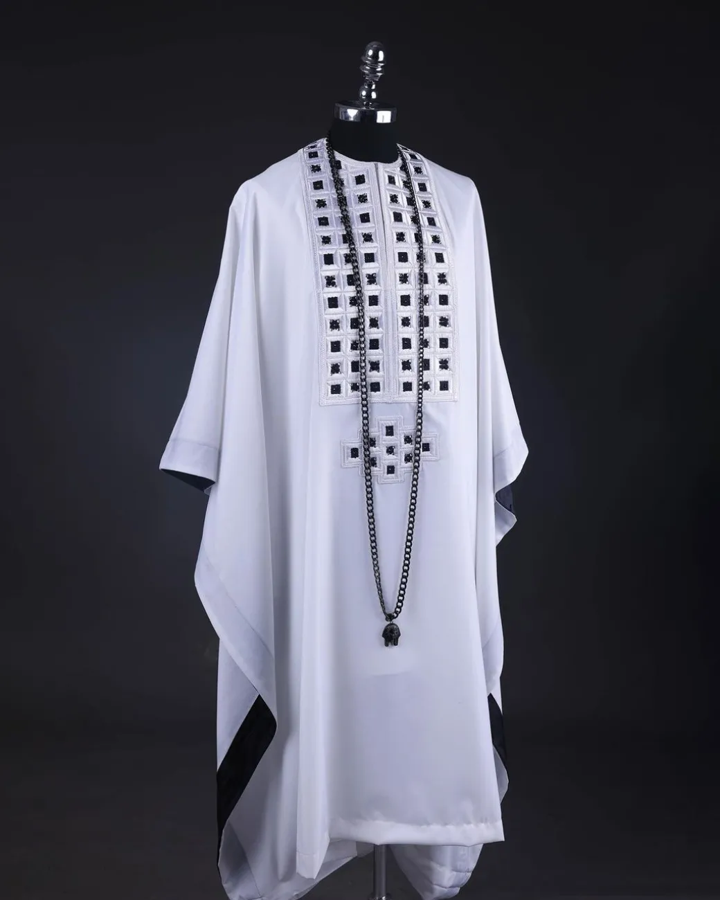 A White, Connected Square Embroidery Design With Matching Black And Silver Swarovski Stone Details Agbada