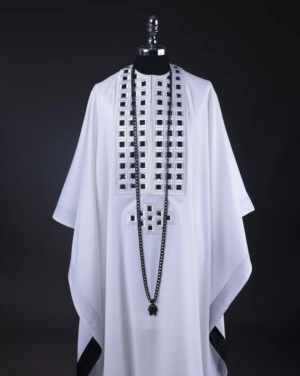 A White, Connected Square Embroidery Design With Matching Black And Silver Swarovski Stone Details Agbada