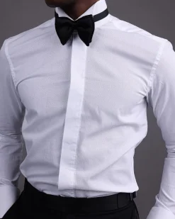 A White, covered button, connected paisley print wing collar tuxedo shirt.