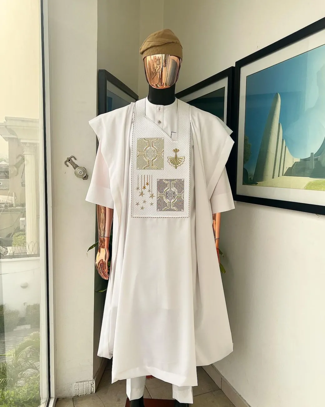 A white, dripping stars and interconnected maze embroidery details agbada
