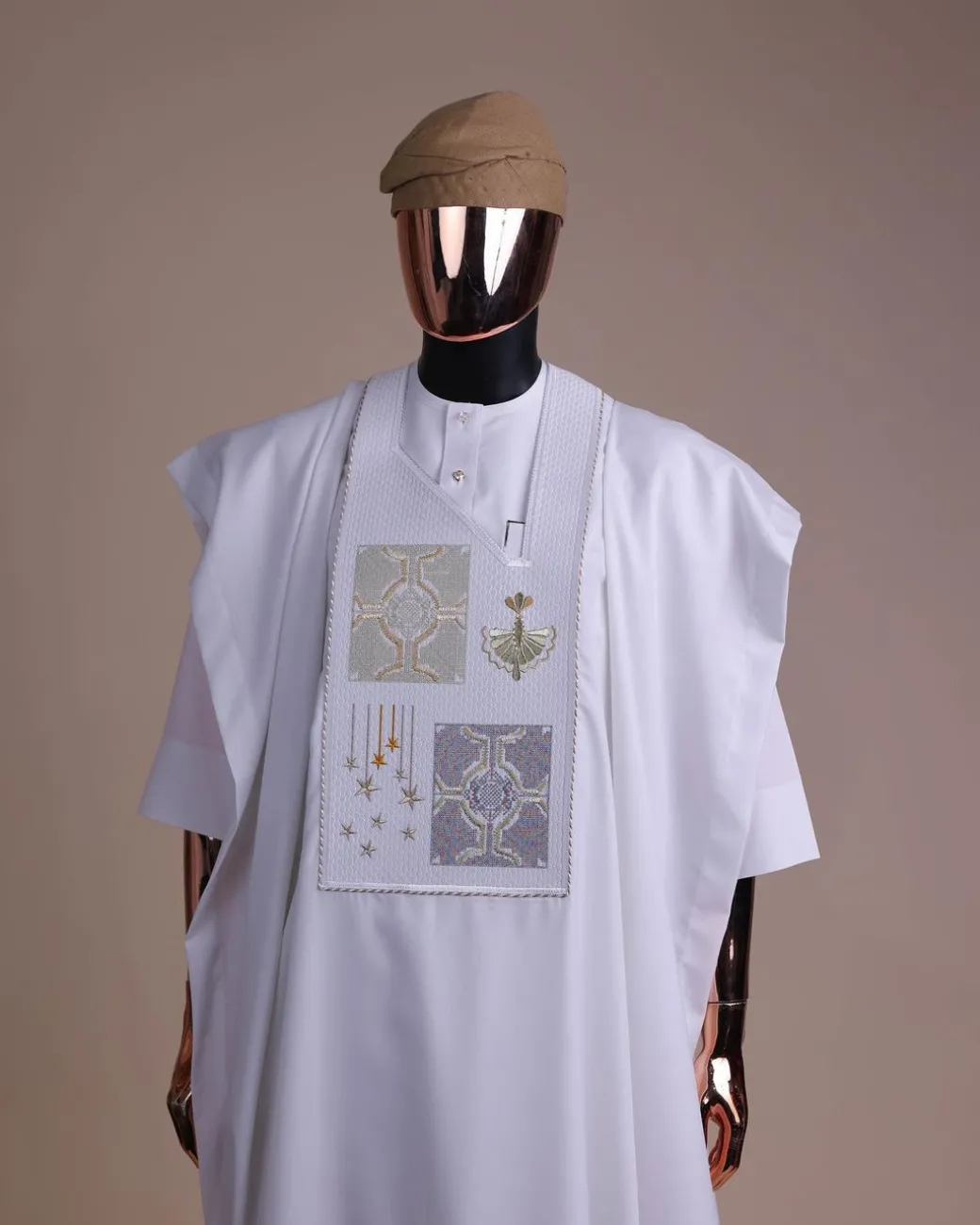 A white, dripping stars and interconnected maze embroidery details agbada