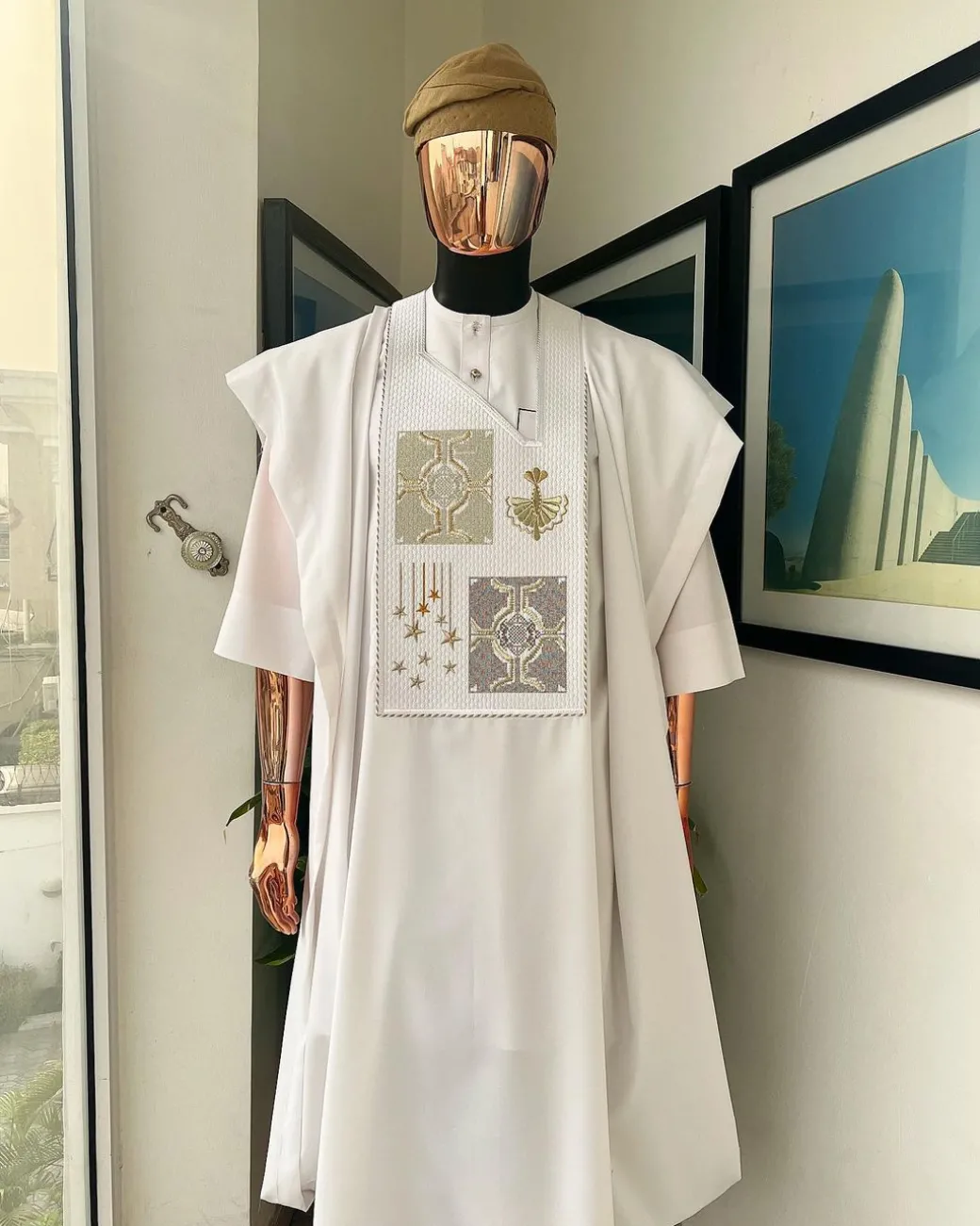 A white, dripping stars and interconnected maze embroidery details agbada