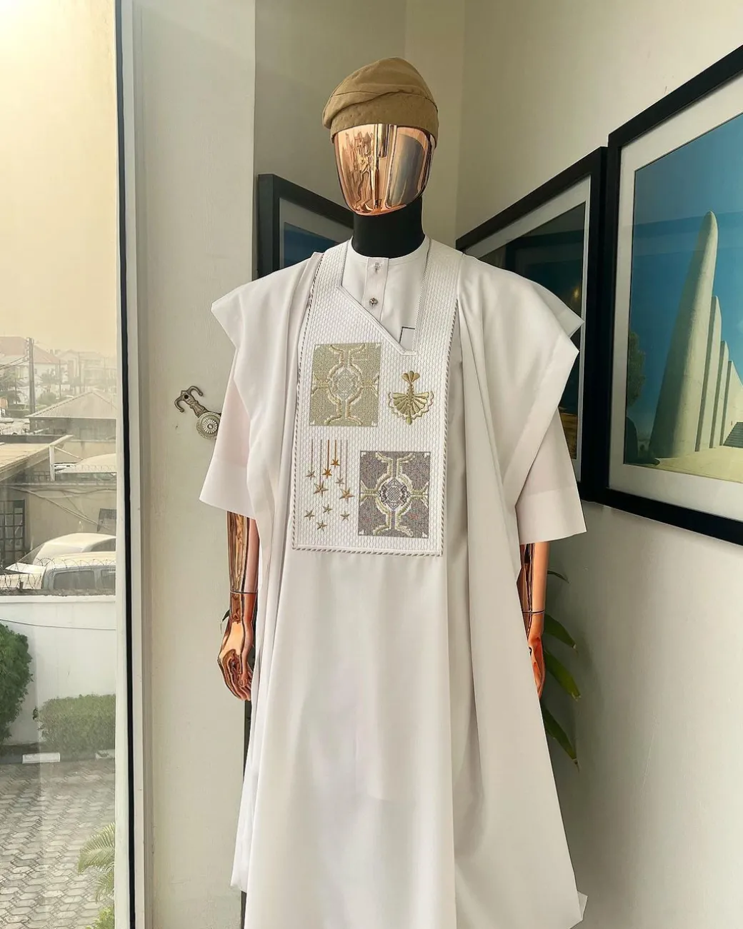 A white, dripping stars and interconnected maze embroidery details agbada