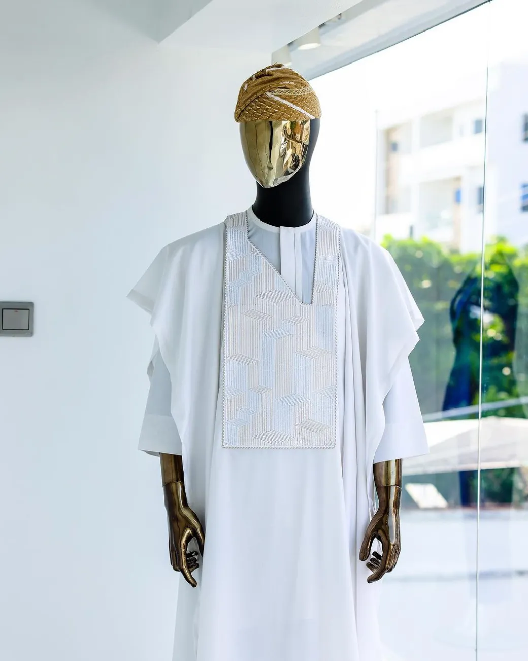 A White, dropping maze line embroidery details agbada, 3/4 sleeve kaftan, and Sokoto