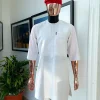 A White, front flap, triple ruffle pocket design & Swarovski button details african traditional senator kaftan native.