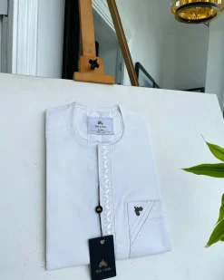 A white front flap with impossible lane embroidery details African traditional senator Kaftan