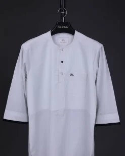 A white, front flap with mixed Swarovski button,3/4 sleeve with velvet cuff details African senator kaftan Native.