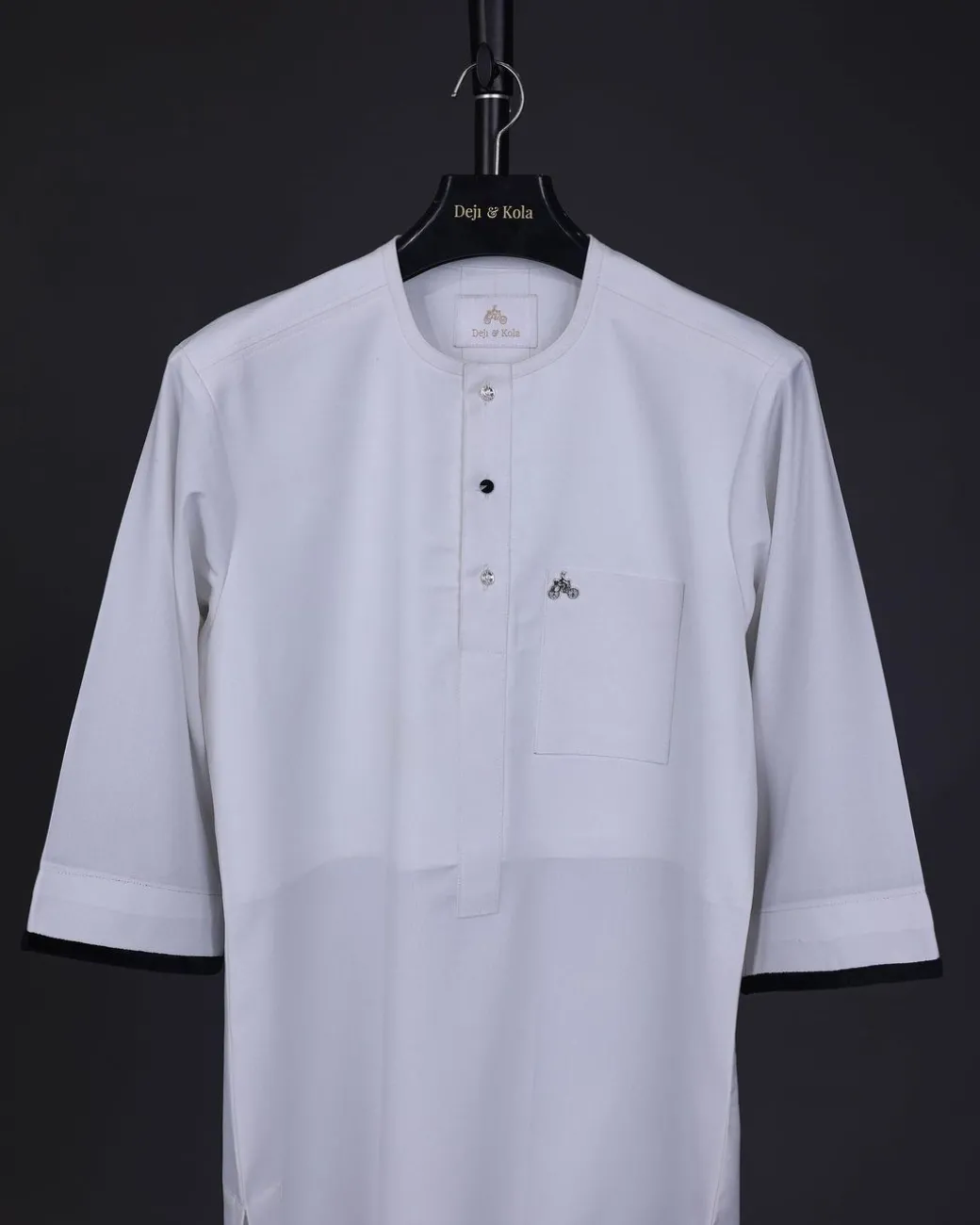 A white, front flap with mixed Swarovski button,3/4 sleeve with velvet cuff details African senator kaftan Native.