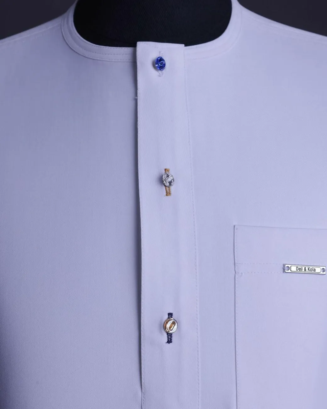 A White, front flap with mixed Swarovski buttons, patch pocket, free hand cuff with (keep walking) embroidery detailing African senator kaftan native.
