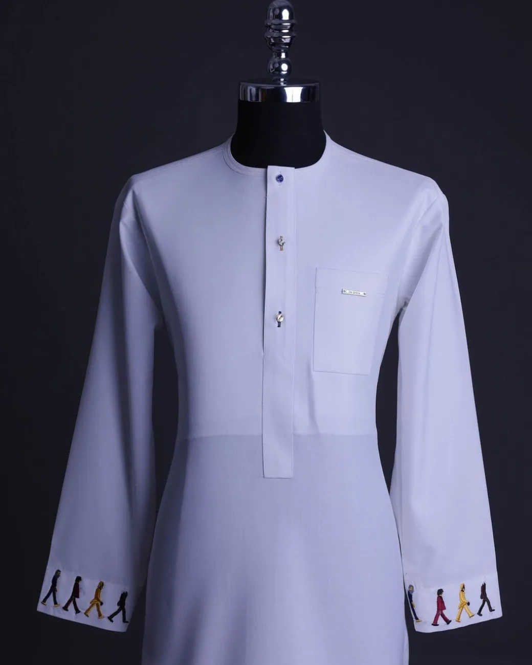 A White, front flap with mixed Swarovski buttons, patch pocket, free hand cuff with (keep walking) embroidery detailing African senator kaftan native.