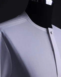 A White, front flap,interwoven buckle, Long sleeve African senator kaftan native.