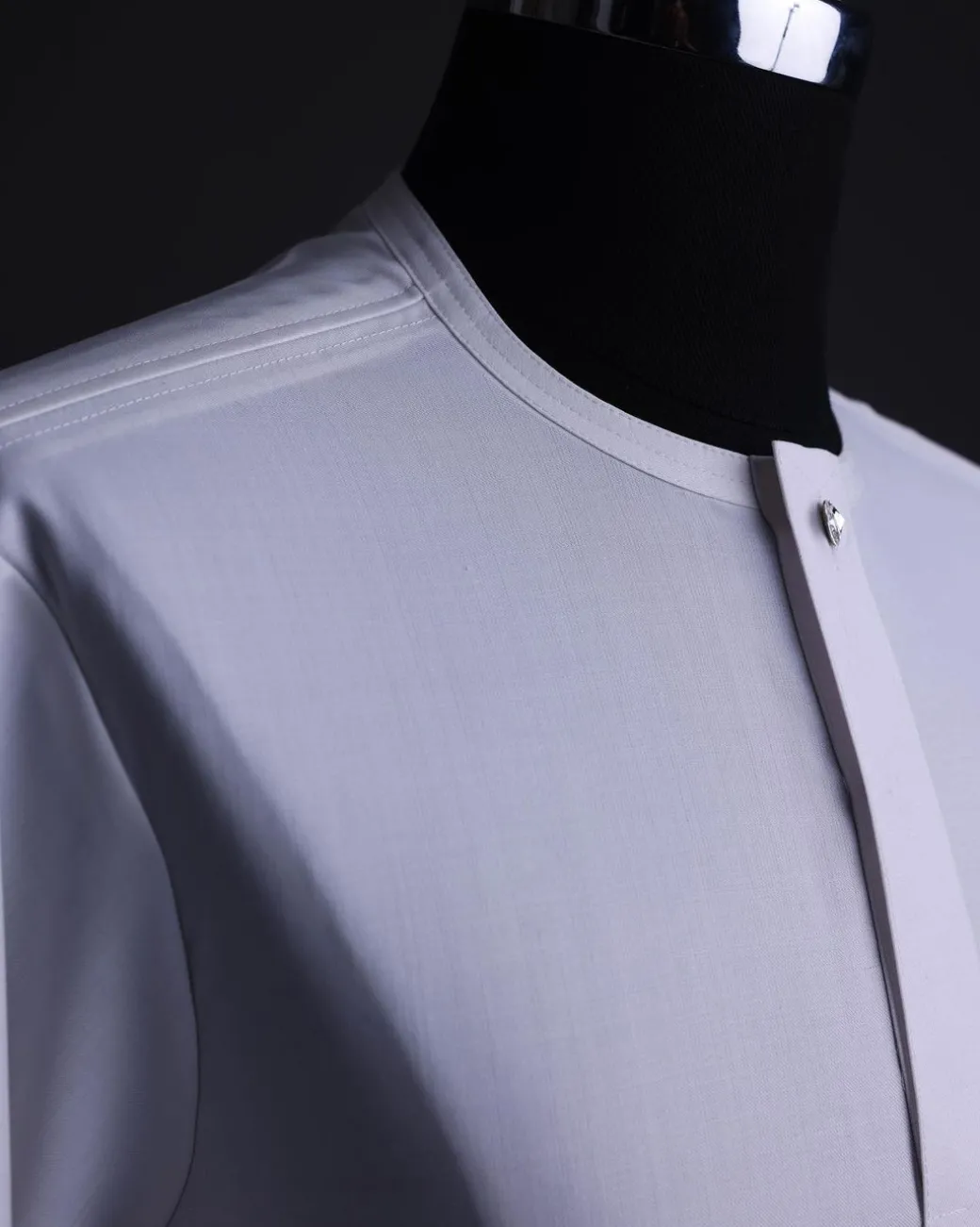 A White, front flap,interwoven buckle, Long sleeve African senator kaftan native.