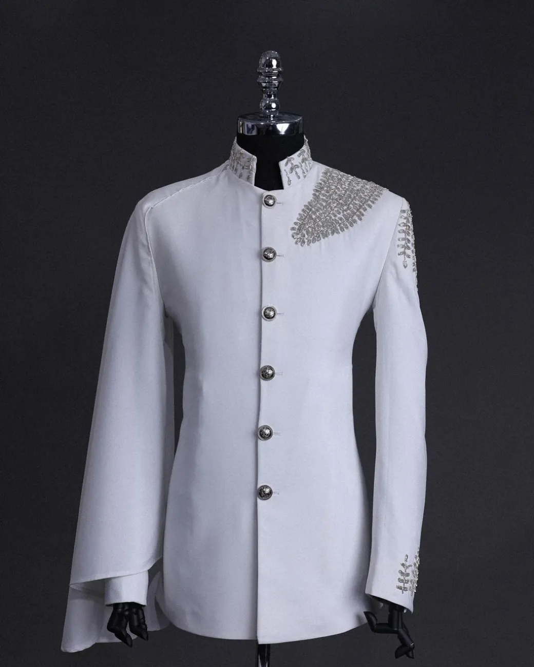 A white, hand “ide” silver metal wire embroidery, right hand sache safari suit