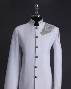 A white, hand “ide” silver metal wire embroidery, right hand sache safari suit
