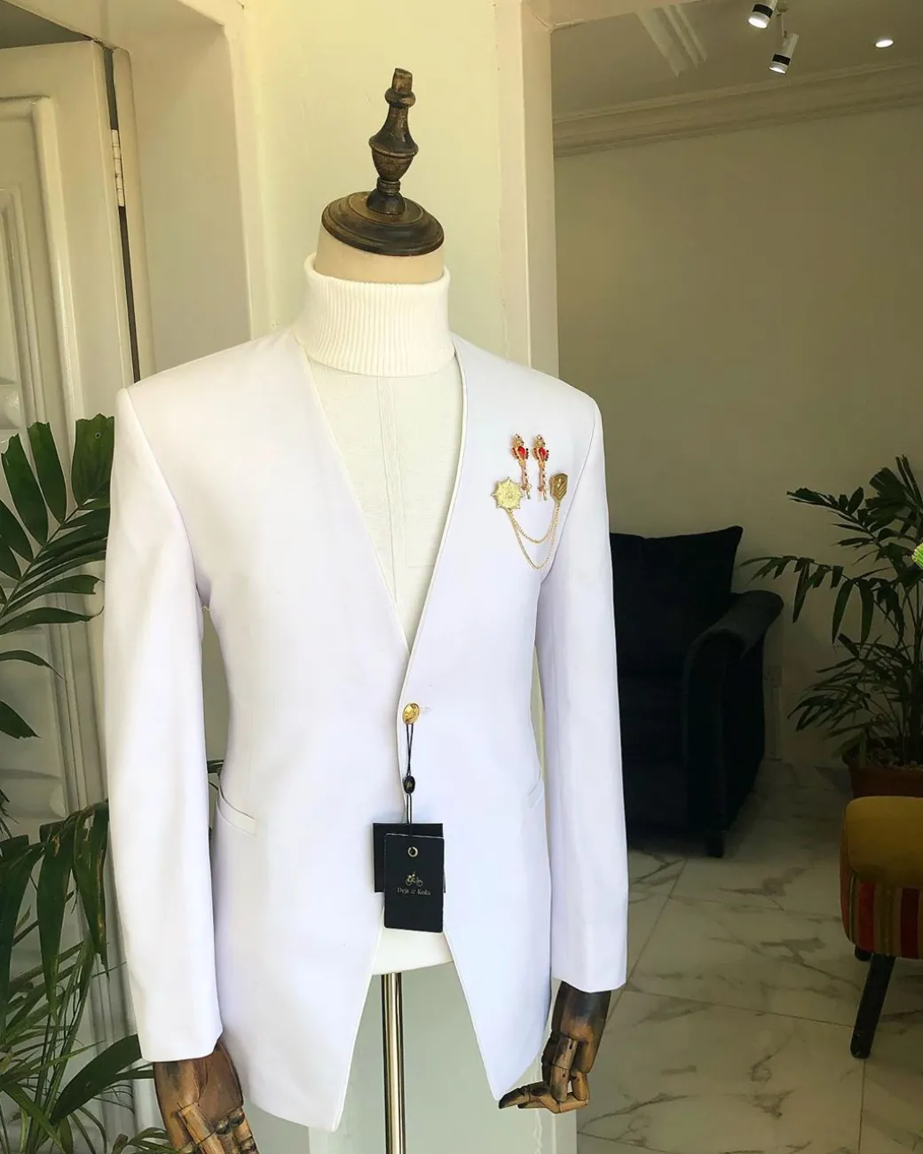 A White “Polaris” lapeless one button tuxedo Suit