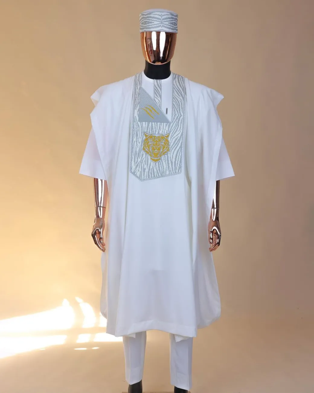 A White, roaring tiger metallic wire embroidery details Agbada