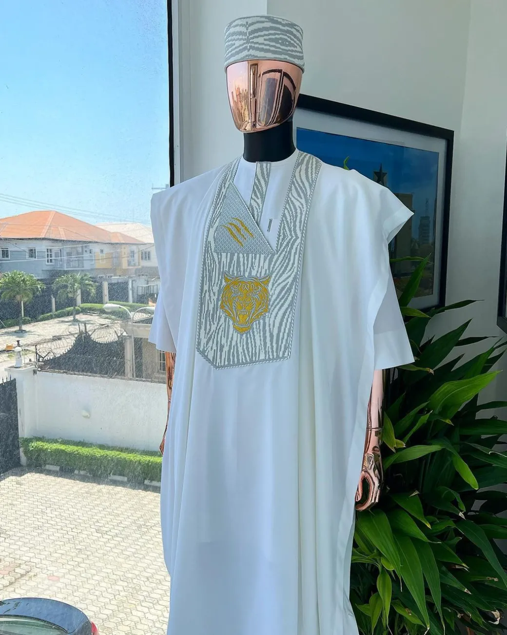 A White, roaring tiger metallic wire embroidery details Agbada