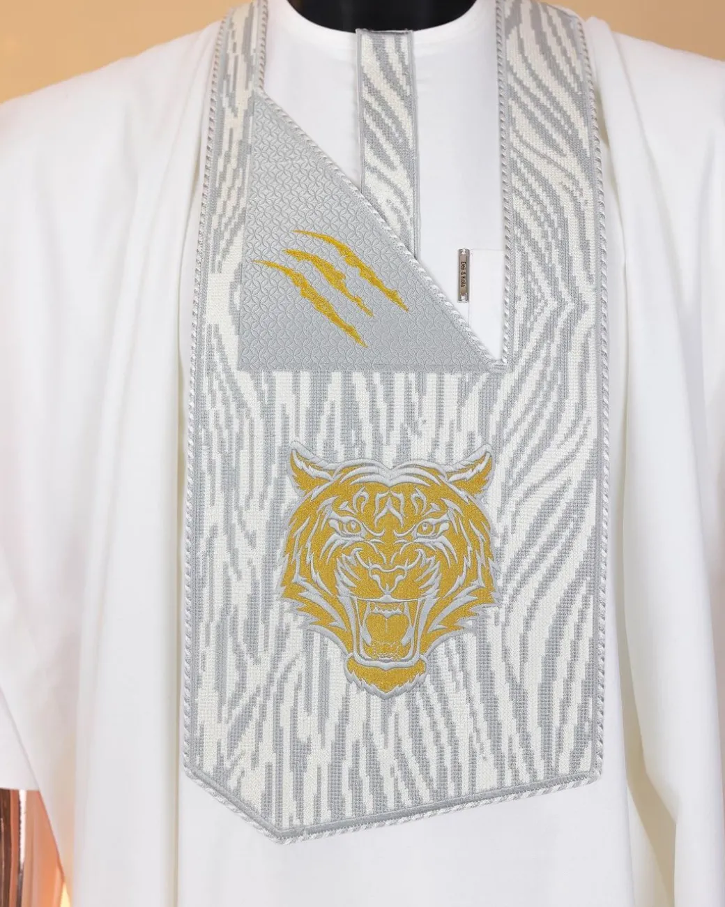 A White, roaring tiger metallic wire embroidery details Agbada