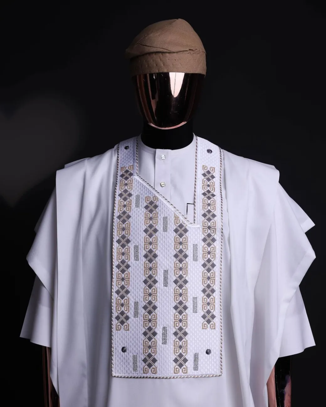 A white, shattered interwoven embroidery with Swarovski stones details agbada
