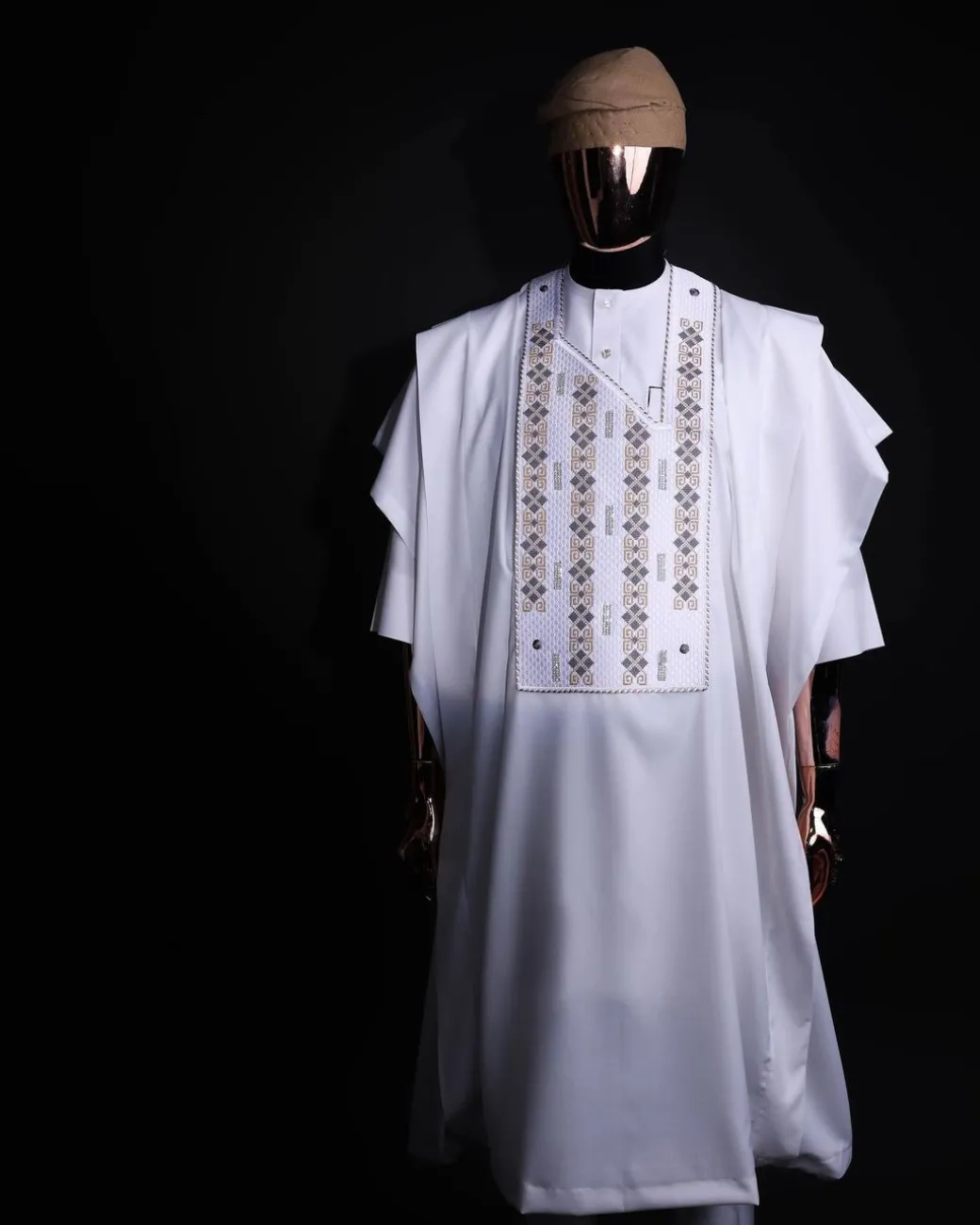 A white, shattered interwoven embroidery with Swarovski stones details agbada