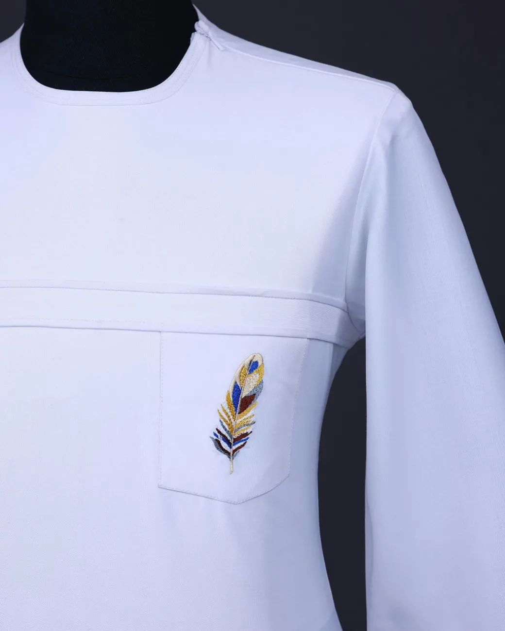 A White T shaped line with Swarovski buttons, leaf embroidery patch pocket, 3/4 sleeve African senator kaftan native.