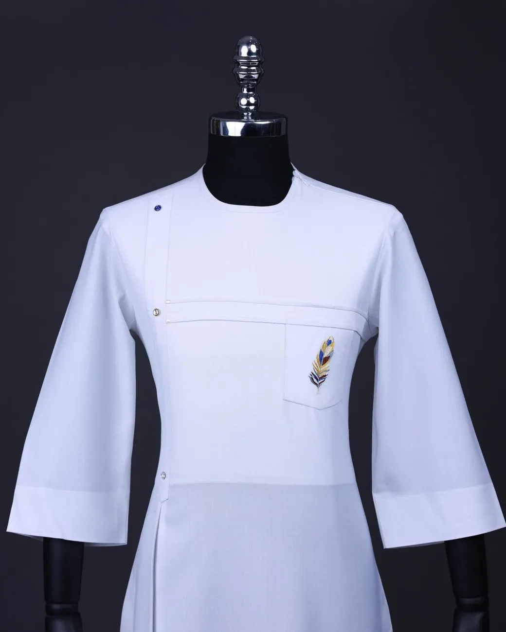 A White T shaped line with Swarovski buttons, leaf embroidery patch pocket, 3/4 sleeve African senator kaftan native.