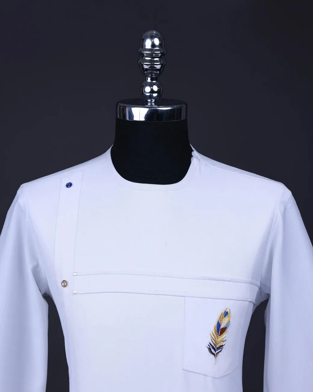 A White T shaped line with Swarovski buttons, leaf embroidery patch pocket, 3/4 sleeve African senator kaftan native.
