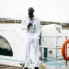 A White “Tropicana” Linen Overcoat & Wide Cut Pant Trousers.