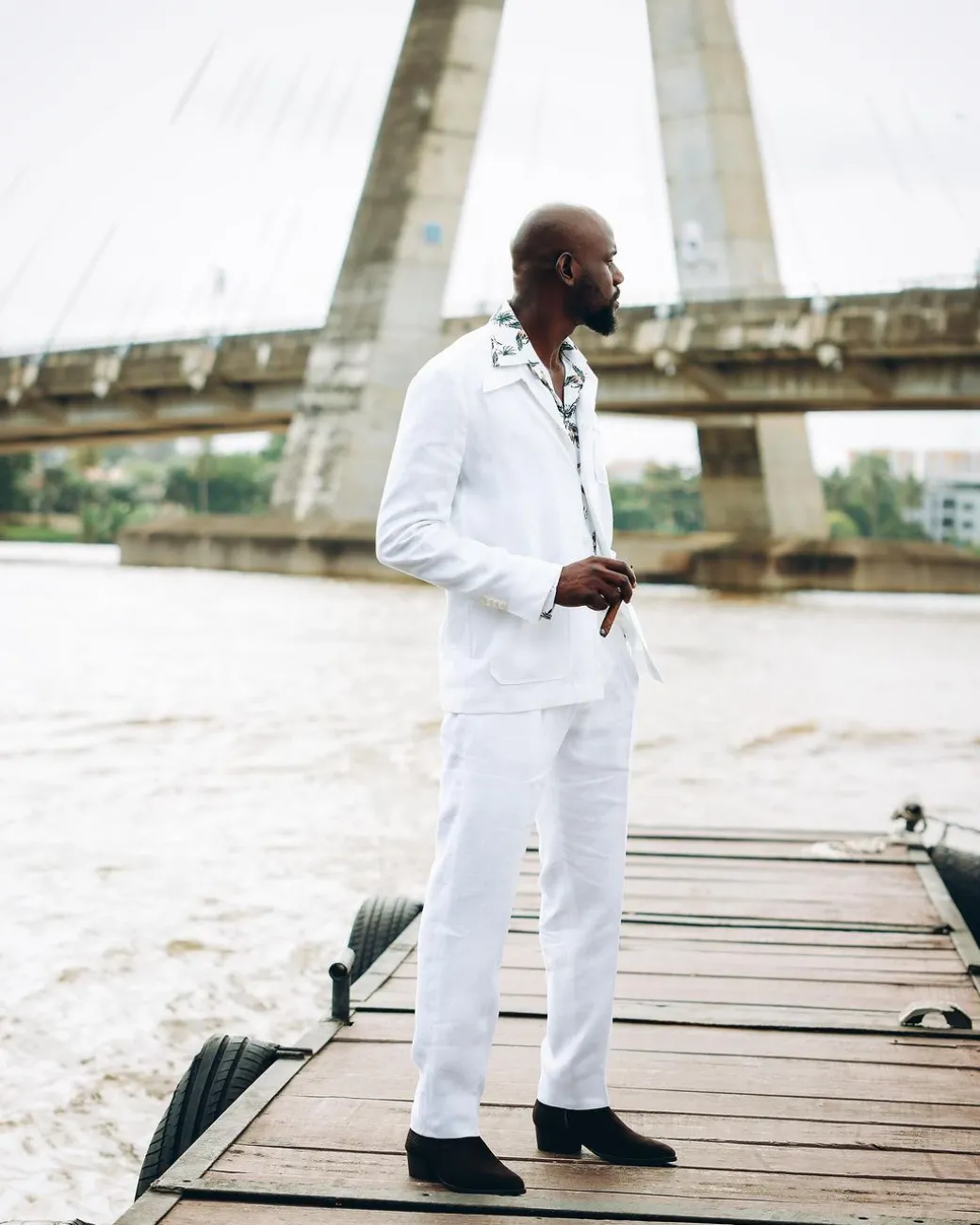 A White “Tropicana” Linen Overcoat & Wide Cut Pant Trousers.