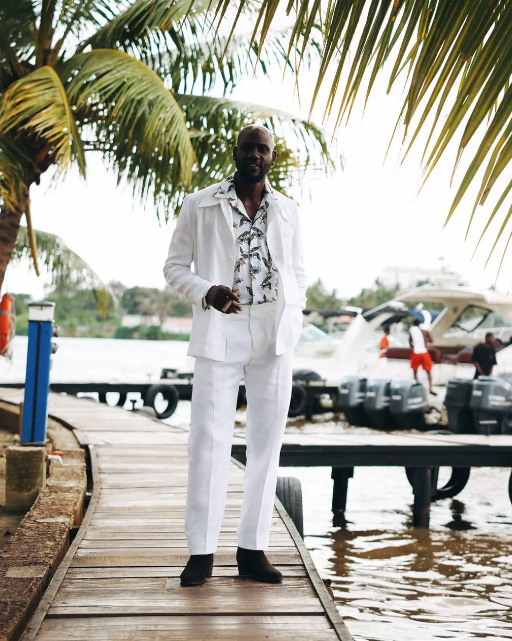 A White “Tropicana” Linen Overcoat & Wide Cut Pant Trousers.