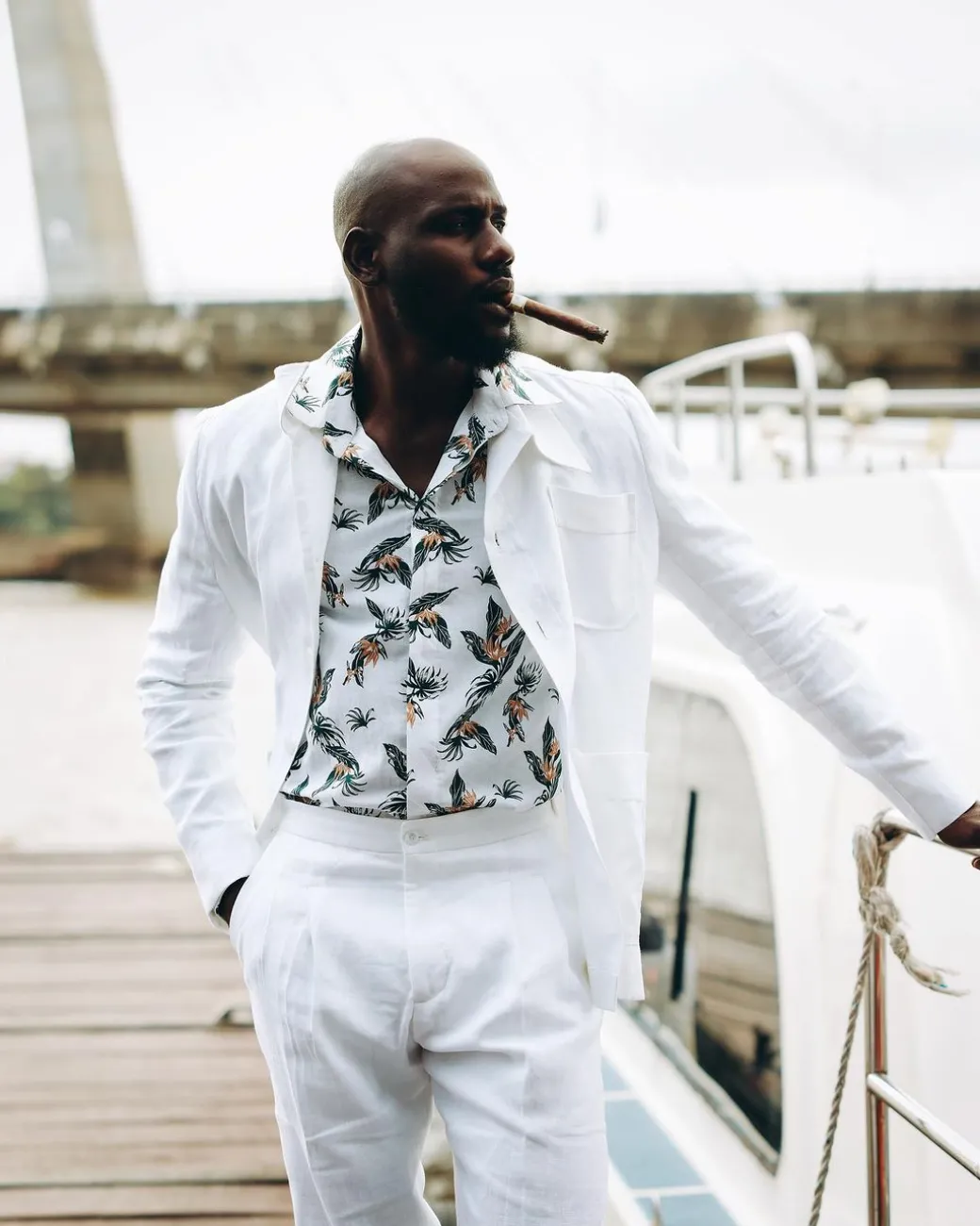 A White “Tropicana” Linen Overcoat & Wide Cut Pant Trousers.