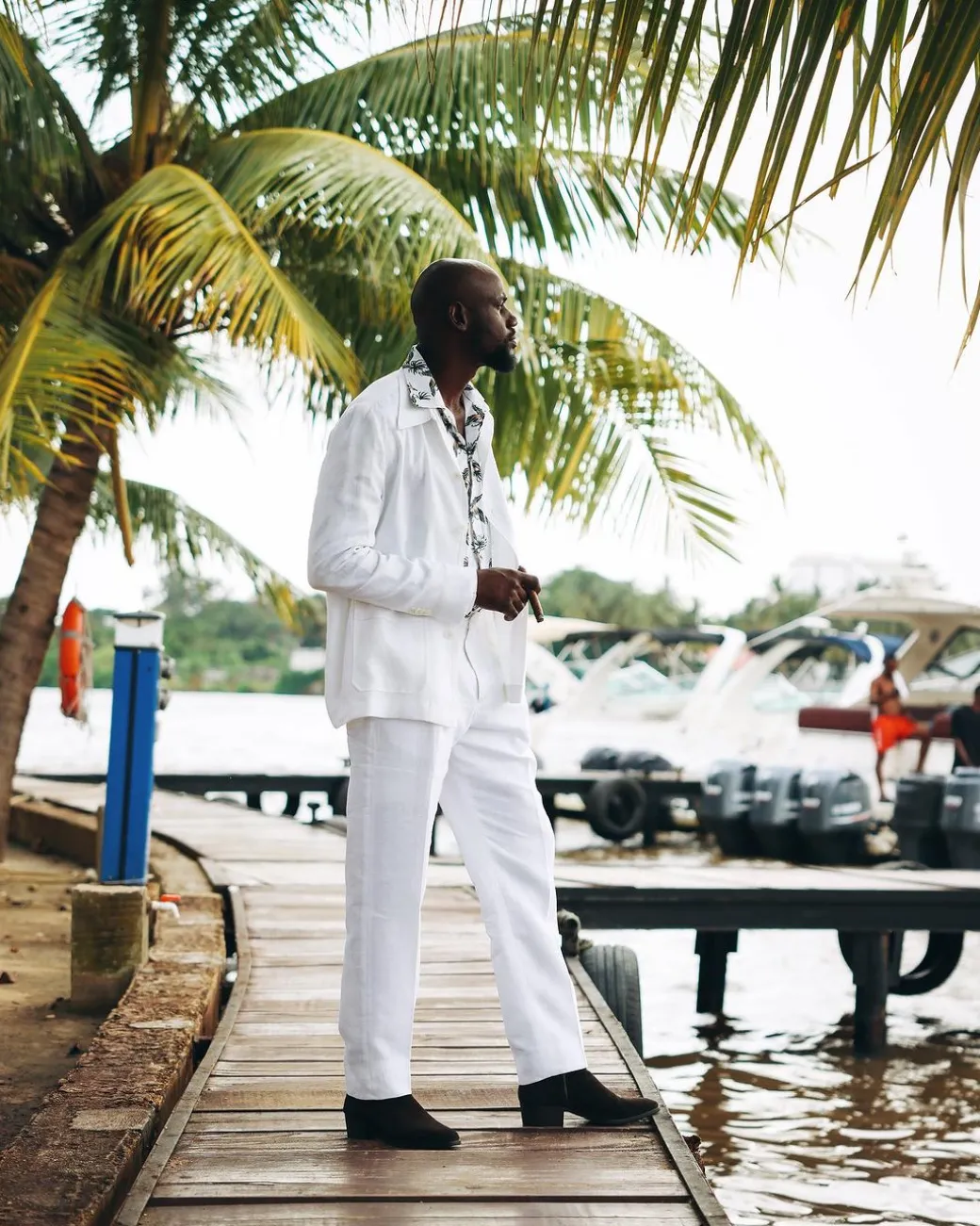 A White “Tropicana” Linen Overcoat & Wide Cut Pant Trousers.
