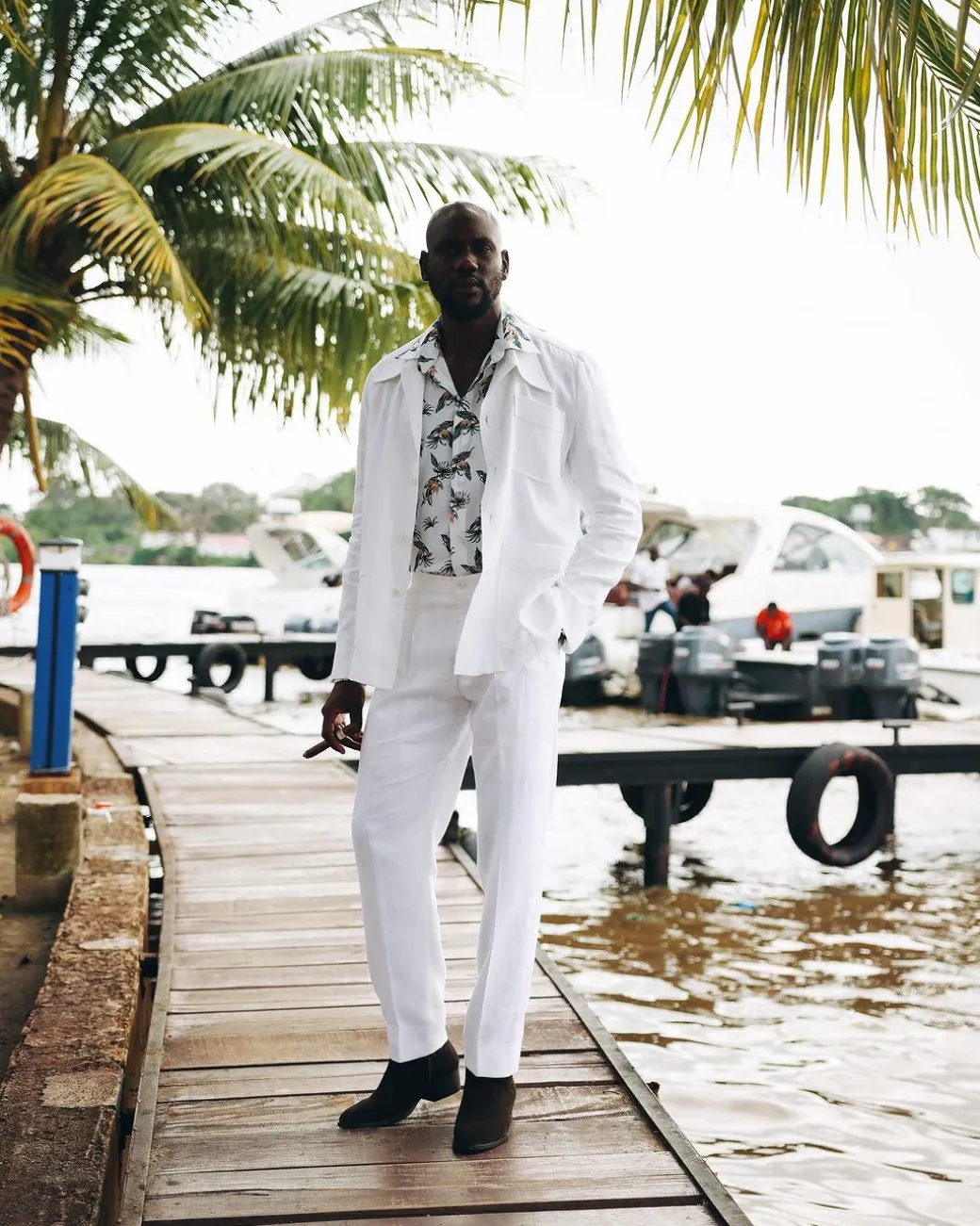 A White “Tropicana” Linen Overcoat & Wide Cut Pant Trousers.