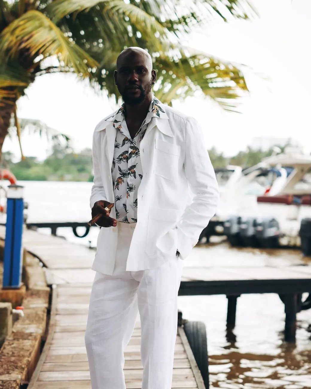 A White “Tropicana” Linen Overcoat & Wide Cut Pant Trousers.