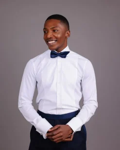 A White, Tuxedo Shirt With Dotted Front Details.
