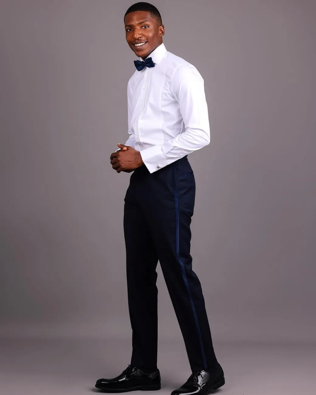 A White, Tuxedo Shirt With Dotted Front Details.