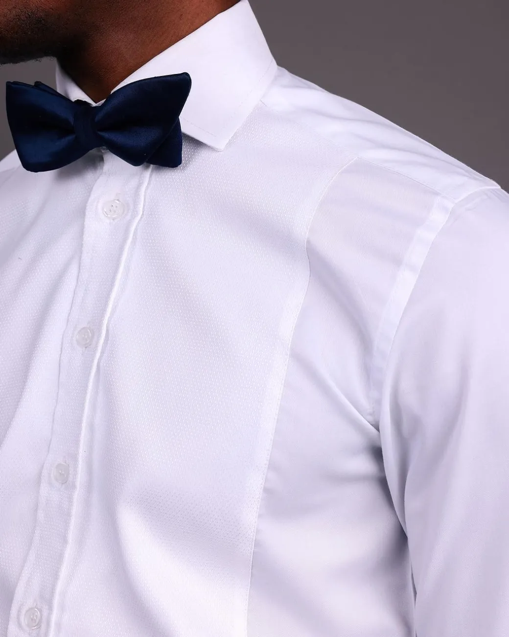 A White, Tuxedo Shirt With Dotted Front Details.