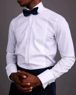 A White, Tuxedo Shirt With Dotted Front Details.
