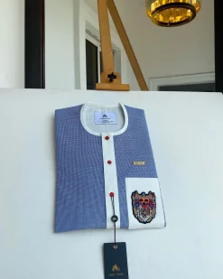 A Windowpane check blue and white mix front flap, hand embroidery patch detailing, and a red Swarovski African Kaftan and Sokoto