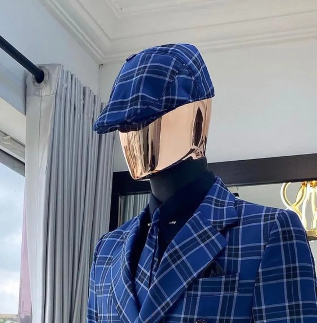 A Windowpane Check Men’s Kangol Papas Hat.