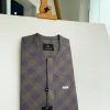 A windowpane tortilla brown with orange and navy blue stripes, a front flap detailing African traditional senator kaftan native.