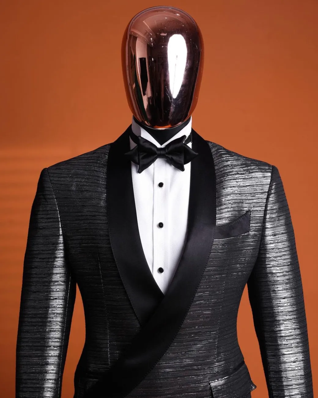 A wire metallic silver and black jacquard, lower cut, wrap shawl lapel tuxedo suit